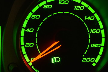bright green speedometer with red arrow