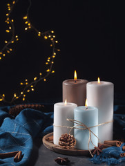 Candles for cold weather. Christmas celebration or cold winter evening concept