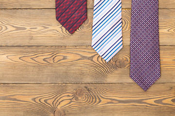 Happy father's day concept with ties on a wooden background. Place under the text