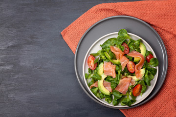 Fresh salad made of salmon, tomatoes and avocado