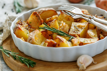 Potatoes baked with bacon and rosemary.