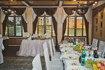 A Banquet room with served meals and food tables 508.