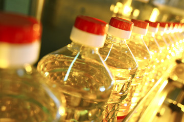 Sunflower oil. Line for the production and bottling of refined oil from sunflower seeds. Conveyor of food industry