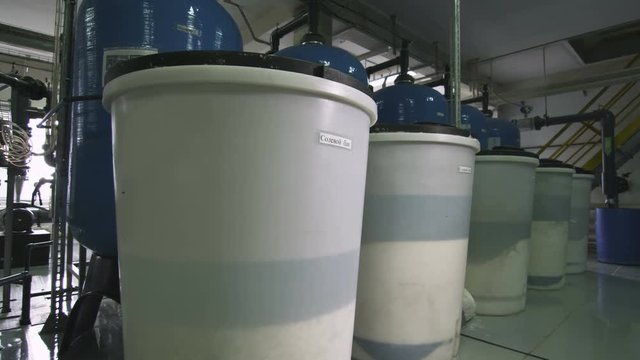 Plastic Tanks with Liquid at Blue Metal Reservoirs