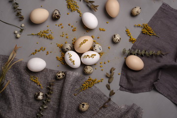 Eggs with flowers and decorative elements on concrete.