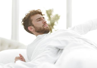 Fototapeta premium closeup.tired man sleeping on the bed.