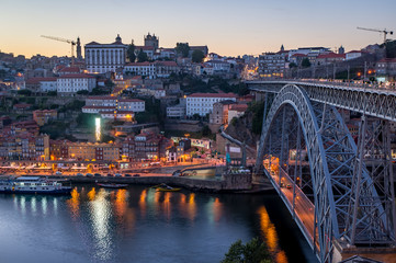 Fototapeta na wymiar Evening view at Porto, Portugal. View at Ribeira and Dom Luis I Bridge.