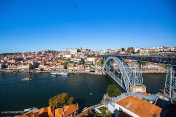 Fototapeta na wymiar Bird's-eye view Douro river and Dom Luis I bridge, shot from Vila Nova de Gaia, Porto, Portugal.
