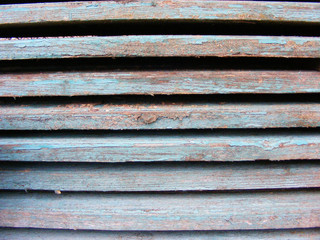 Old wood to a blue wall background texture