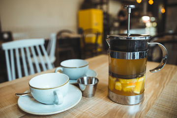 comfy cafe couple cups and french press with tea