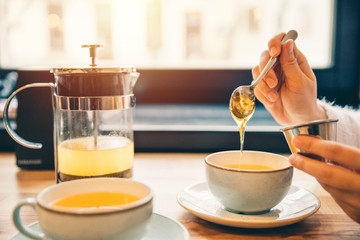 woman drink hot orange tea