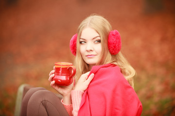 Girl with cup in park.