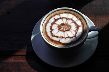 cup of hot latte art coffee