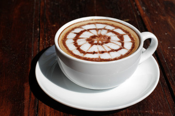 cup of hot latte art coffee