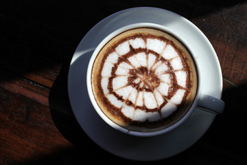 cup of hot latte art coffee