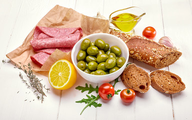 Delicacy with sausage olive and lemon lunch fresh bread snack