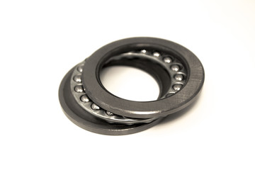 One isolated industrial bearing unit with ball cage for rolls or wheels