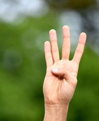 Male Hand Counting Four