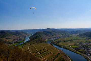 loop of river Mosel at Bremm with Paraglider, Germany