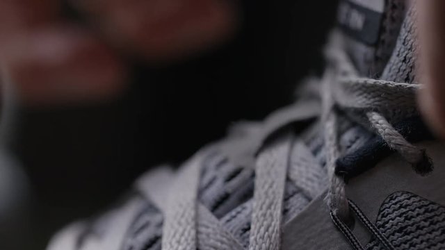 Close up of shoe laces on sports shoes being tied up