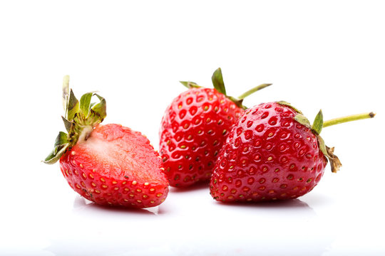Red frsehly harvested straberry on white background