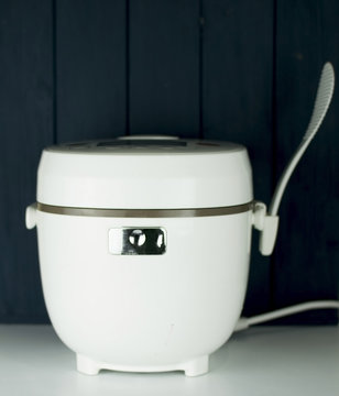 white multivark on white surface with wooden background