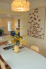 Yellow Flower Vase on Kitchen Table with Wall Art