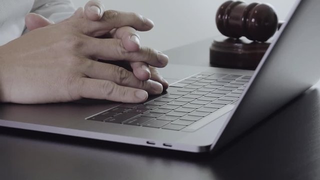 Close up Hand Lawyer working with laptop computer in office in slow motion