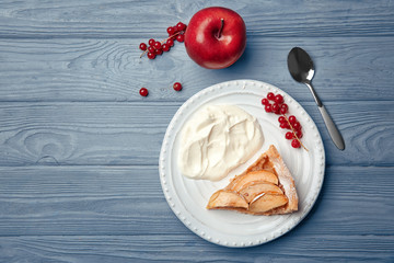 Composition with piece of tasty apple tart on table, top view