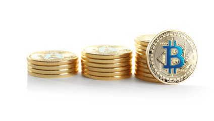 Golden bitcoins on white background