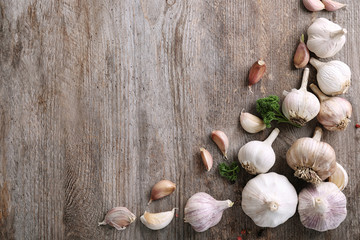 Composition with garlic on wooden background