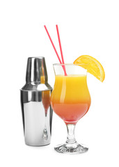 Glass of Sex on the Beach cocktail and shaker against white background