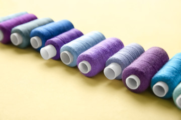 Set of sewing threads on light background