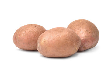 Fresh raw potatoes on white background