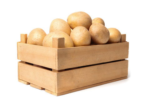 Wooden container with fresh raw potatoes on white background