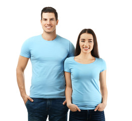 Fototapeta premium Young man and woman in stylish t-shirts on white background. Mockup for design