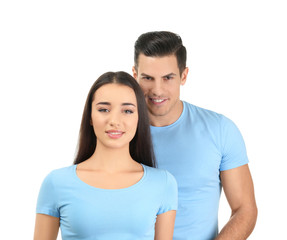 Fototapeta premium Young man and woman in stylish t-shirts on white background. Mockup for design