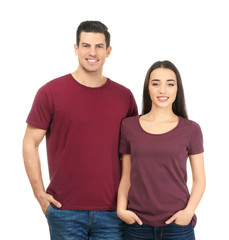 Fototapeta premium Young man and woman in stylish t-shirts on white background. Mockup for design