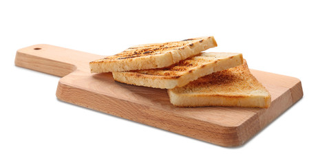 Wooden board with toasted bread on white background