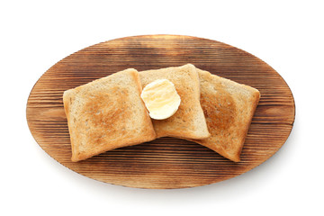 Wooden board with toasted bread on white background