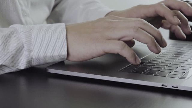 Close up Hand Lawyer working with laptop computer in office in slow motion