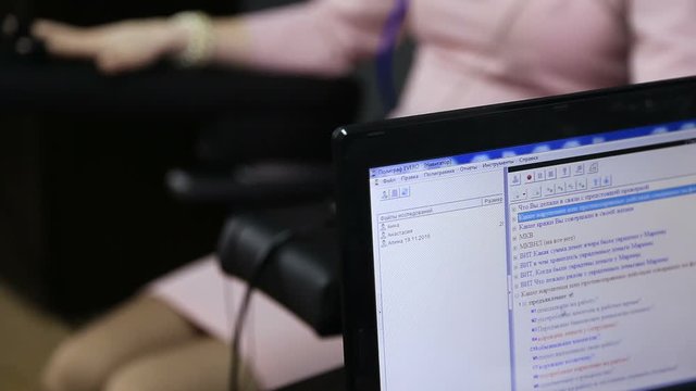 Lie-detector test, a woman answers the questions of the expert