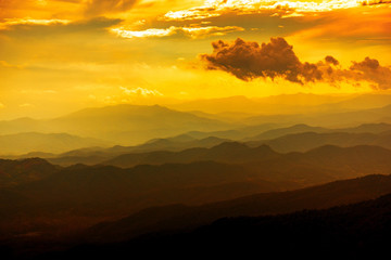 Dramatic scene Majestic sunset in the mountains landscape with clouds
