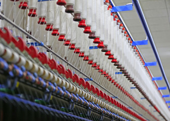 Fototapeta premium The modern spinning machine works in the workshop