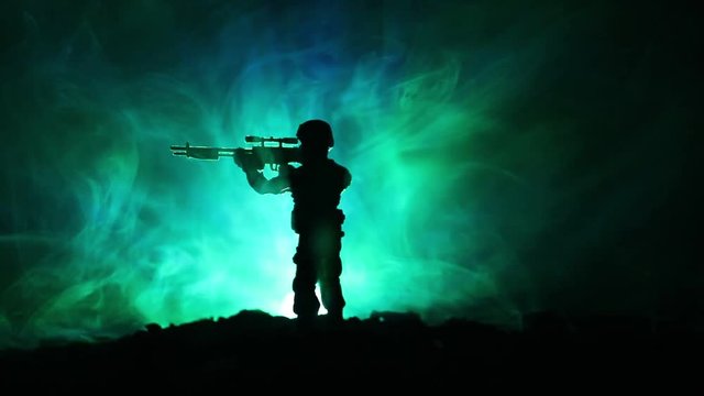 Army sniper with large-caliber sniper rifle seeking killing enemy. Silhouette on sky background. National security ensured, servicemen on guard. Battle scene