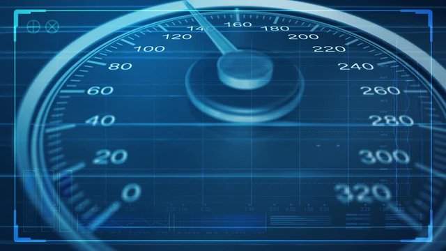 A macro closeup pan of a regular speedometer with glowing markings and a needle accelerating towards a high speed overlaid with a technical analysis data interface