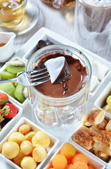 Marshmallow dipped in delicious melted chocolate fondue.