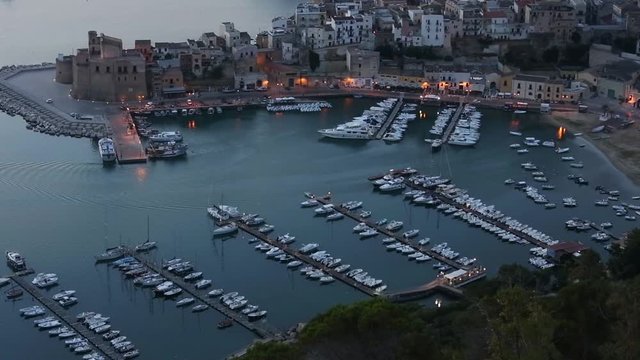 Early morning preceding dawn Tyrrenian sea bay near Castellammare del Golfo town, firtress and pier from resting place Localita Belvedere Castellammare del Golfo (Trapani region, Sicily, Italy).