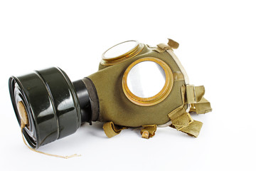 War sign. Gas mask from ww2. Used vintage green and black gas mask can illustrate danger, war, catastrophe, or other concept. Gas mask on isolated white studio background. Easy to use for your work.
