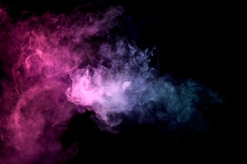 Thick colorful smoke of  purle and pink on a black isolated background. Background from the smoke of vape